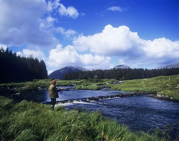 Side Profile Of A Man Fly-Fishing In A River, Connemara, County Galway, Republic Of Ireland