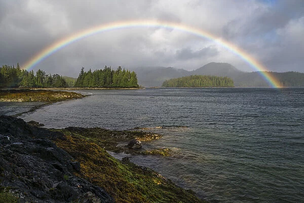 Rainbow Forms Over The Ocean During A Wind And Rain Storm; Haida Gwaii, British Columbia, Canada