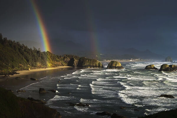 Rainbows Seen Through Storm Clouds Over Crescent Beach; Cannon Beach, Oregon, United States Of America