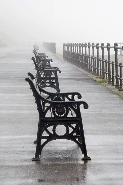 Redcar, North Yorkshire, England; Row Of Benches Overlooking The Beach And Sea