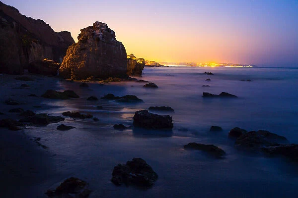 Rock formations along El Matador state beach at night near Los Angeles, Malibu, California, USA