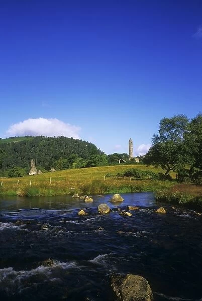 Round Tower And River In The Forest, Glendalough, Wicklow Mountains, Republic Of Ireland