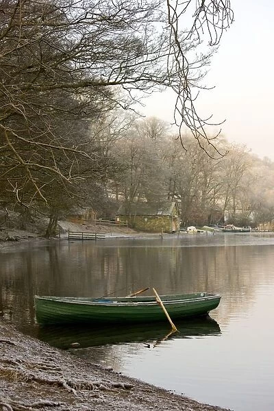 Rowboat Sitting At The Shore Of A Lake, Cumbria, England
