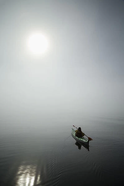 A Sea Kayaker Paddles Into Thick Fog On On A Calm Morning In Southeast Alaskas Stephens Passage. Mr_ Ed Emswiler, Id#12172012A