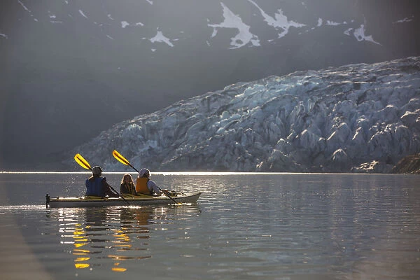 Sea Kayakers Paddling In Evening Light At Shoup Bay State Marine Park, Prince William Sound, Valdez, Southcentral Alaska