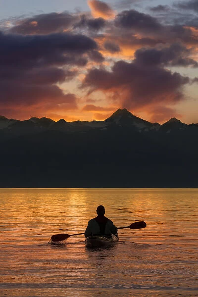 Sea Kayaking On A Sublime Evening In Lynn Canal Near Eagle Beach State Recreation Area, Juneau. Alaska. Chilkat Mountains Beyond In The Distance