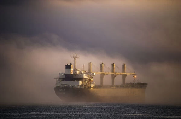A Ship Anchors In The Fog On The Columbia River; Astoria, Oregon, United States Of America