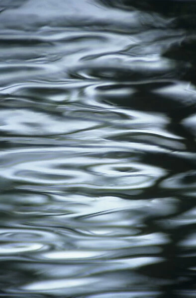 Silver Water Ripples And Light Reflections