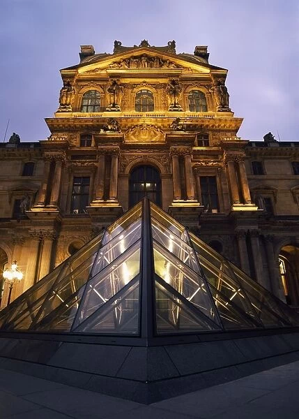 Small Glass Pyramid Outside The Louvre Museum At Dusk