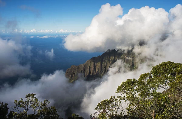 A Spectacular View Materializes Out Of The Mist; Kalalau, Kauai, Hawaii, United States Of America