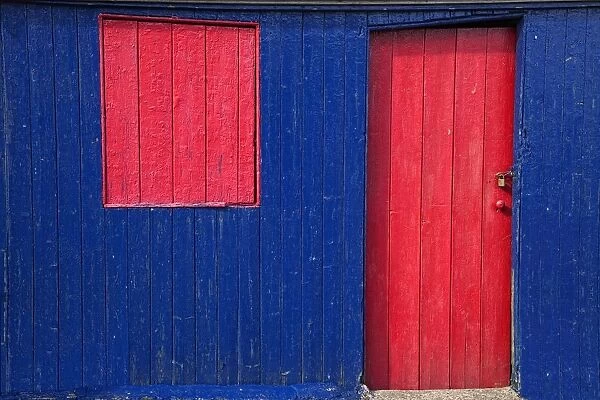 St. Abbs Head, Scottish Borders, Scotland; A Red Door And Window On A Blue Wooden Building
