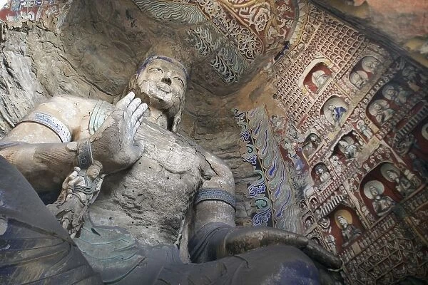 Statue And Carvings In Ancient Buddhist Temple Grotto