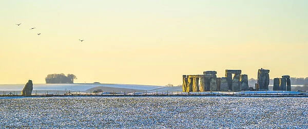 Stonehenge defined by early morning snow, Wiltshire, England, UK