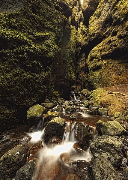 A Stream Runs Through A Slot Canyon Along The Southern Coastline Of The Snaefellsnes Peninsula; Iceland