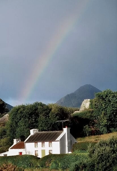 Sugarloaf Mountain, Glengarriff, Co Cork, Ireland; House With A Rainbow And Mountain In The Distance