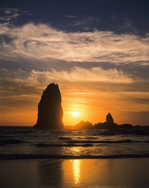 The Sun Sets Along The Oregon Coast; Cannon Beach, Oregon, United States Of America
