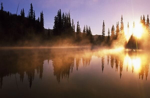 Sunbeams Through Mist On Lake
