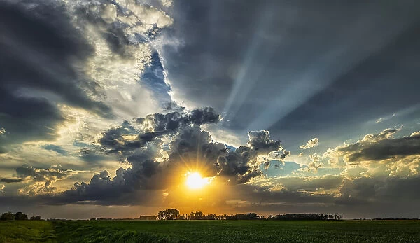 Sunburst from clouds over the prairies