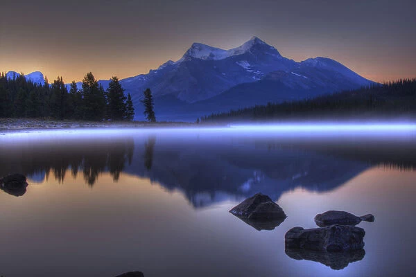 Sunrise On A Foggy Maligne Lake In Jasper National Park, Alberta
