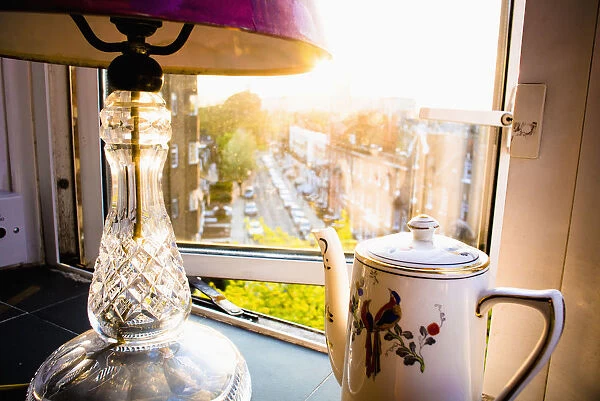 Teapot And Lamp On Windowsill In Afternoon Sun, Barons Court; West London, England