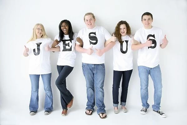 Five Teenagers With T-Shirts Spelling Jesus