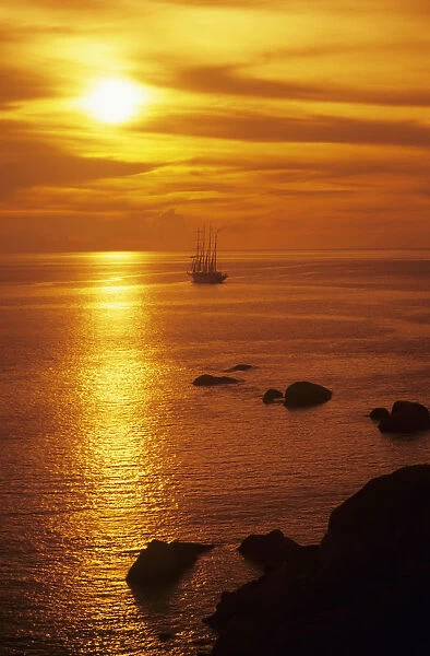 Thailand, Orange Sunset Over Four-Mastered Cruiseship On Ocean; Similan Islands