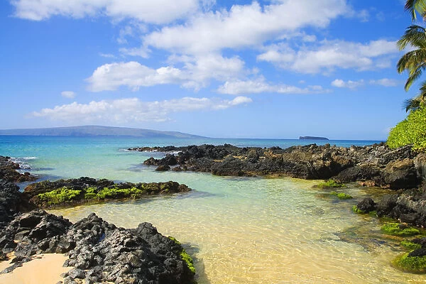 USA, Hawaii Islands, Maui, Shallow Ocean Water Surrounded By Rocks And Sand; Makena, Maui Wai Or Secret Beach