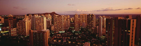 USA, Hawaii, Kauai, Evening Glow On City Buildings At Dusk; Waikiki