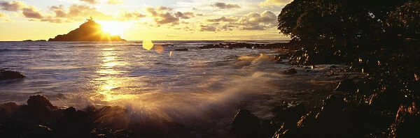 USA, Hawaii, Maui, View Of Sunrise Bursting Over Alau Island From Hana Shoreline; Hana