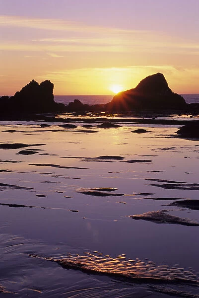 USA, Sun Setting Over Rocks And Beautiful Reflections; Oregon, Seal Rock