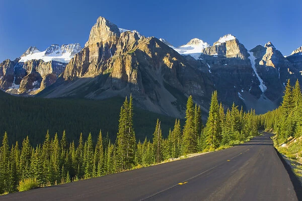 View Of Glacial Mountains And Trees Along The Road To Lake Moraine In Banff National Park; Alberta Canada