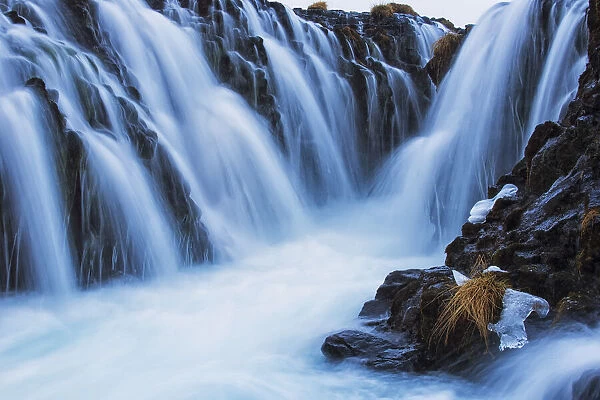 Waterfalls Flowing Over Rugged Rock Cliffs; Bruarfoss, Iceland