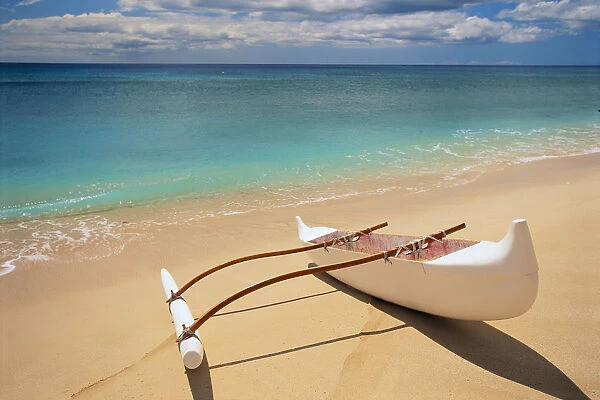 White Outrigger Canoe On Shoreline With Shadow, Calm Turquoise Water