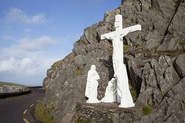 White religious figures standing on a rock beside the road at slea head near dunquin on the dingle peninsula; County kerry ireland