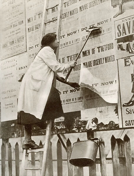 A Woman Posting Bills During An Intensive Campaign To Obtain More Money And Men During World War One. From The Story Of 25 Eventful Years In Pictures Published 1935