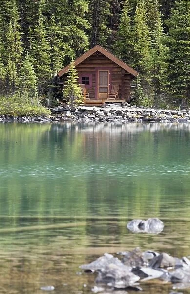 Wooden Cabin Along A Lake Shore