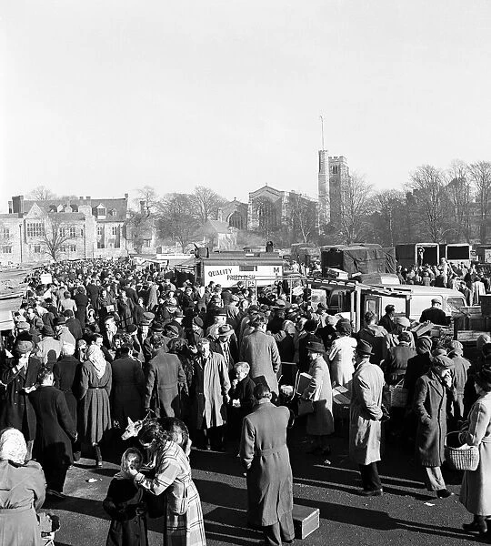 Busy scene showing shoppers and traders at Maidstone market in Kent. 28th November 1952