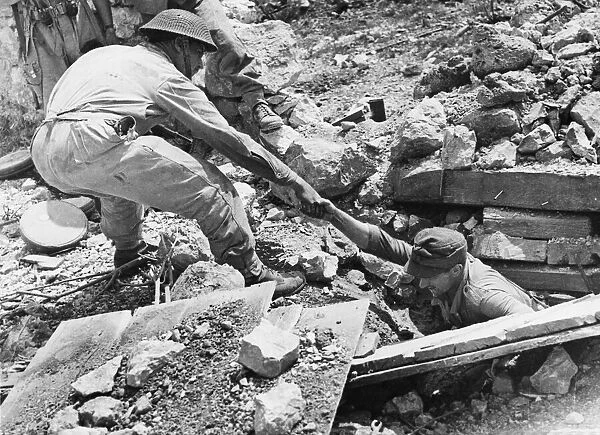 German caught at Piedimonte Matese, pulled from rubble. 6th June 1944