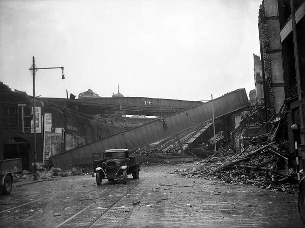 London Air Raid Bomb Damage WW2 An abandoned truck near the remains of a railway