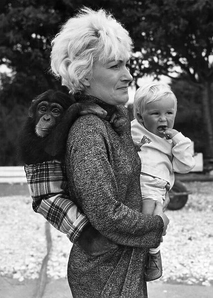 Olga Dennver with baby Carl and chimp Fibber on her back. September 1969 P011904