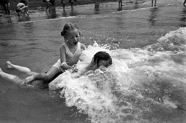 In surf at Brighton - Gladys Tester. August 1952 C3867-002