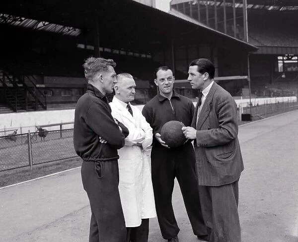 Ted Drake with Chelsea members April 1955