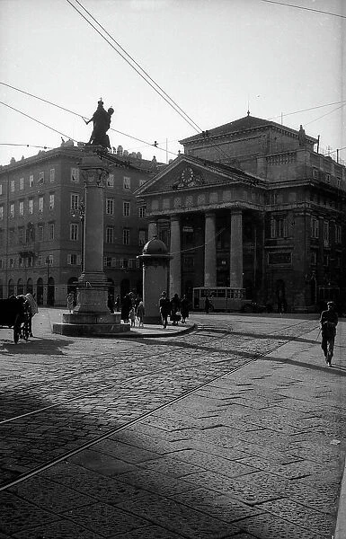 Borsa square with the Palace of the Chamber of Commerce (formerly the Stock Exchange) and the column with the statue of Leopold I in Trieste