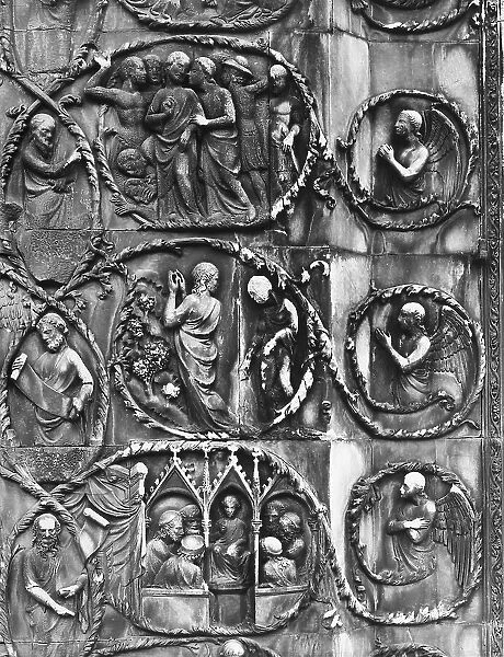 The Judas kiss and the disput in the Temple. Detail of the bas-relief with the Evangelical Stories, by Lorenzo Maitani in the third pillar of the facade of the cathedral of the Assunta in Orvieto