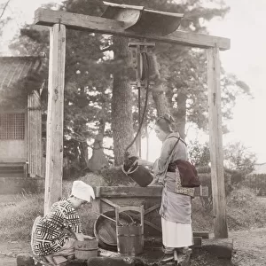 Girls drawing water from a well, with buckets, Japan