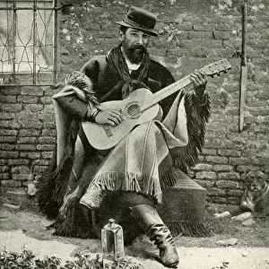 Man playing a guitar, Argentina, South America