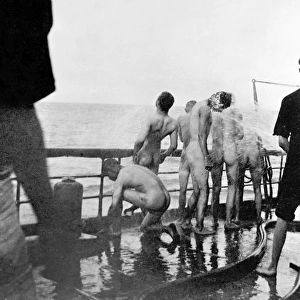 Sailors on the U. S. S. Yankee take a morning bath