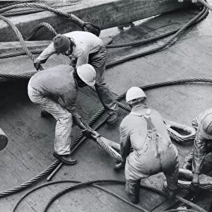 Workmen on oil rig supply ship off The Lizard, Cornwall