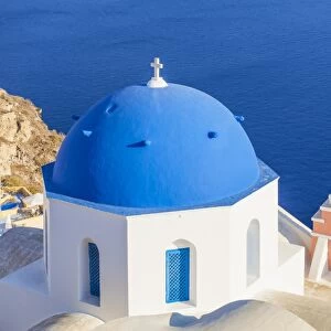 Greek church with blue dome and pink bell tower, Oia, Santorini (Thira), Cyclades Islands, Greek Islands, Greece, Europe