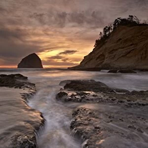 Haystack Rock at sunset, Pacific City, Oregon, United States of America, North America
